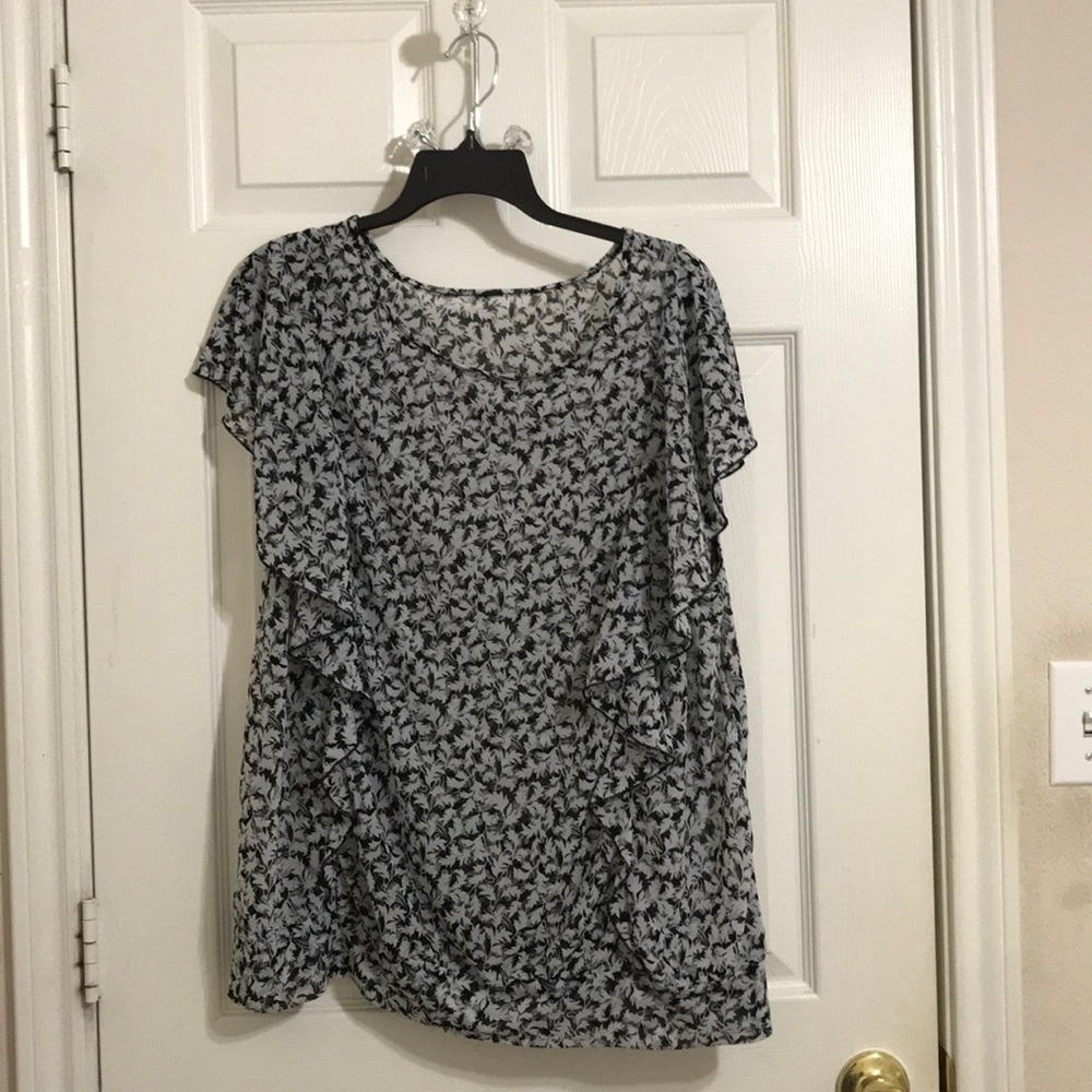 Sheer gray, Black and white ruffled blouse.